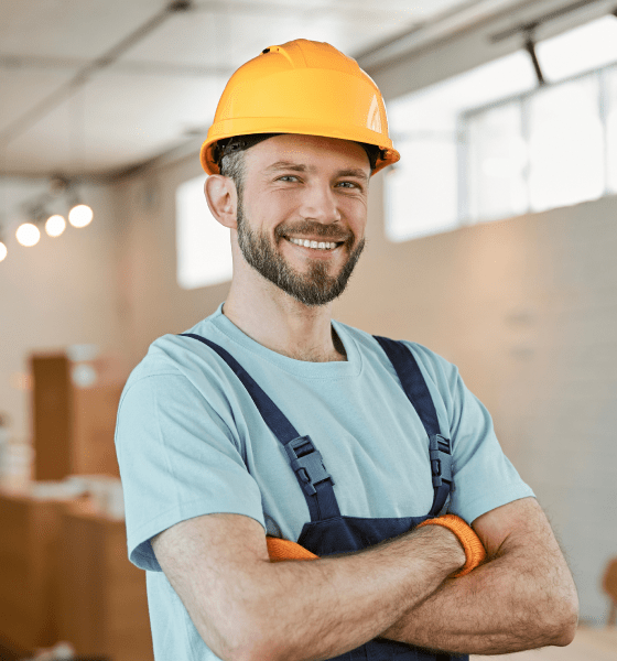 an expert electrician wearing yellow helmet and folding hand with full of smile